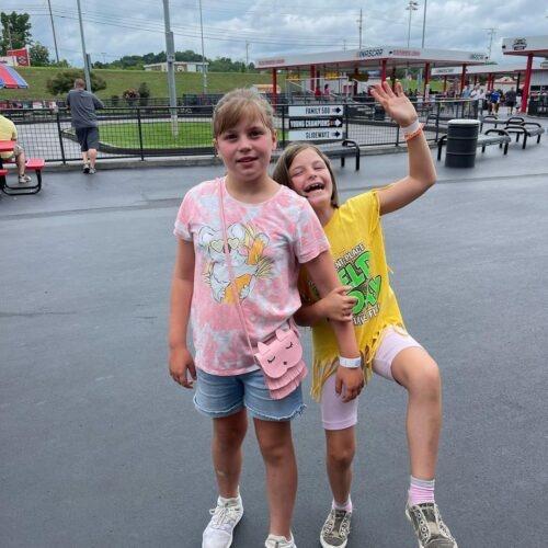 two little girls having fun in the park