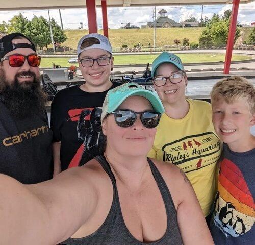 A family taking a selfie on the racetrack