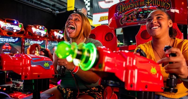 woman playing in arcade